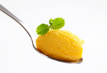 Yellow ice cream on spoon