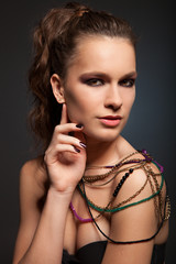 Obraz premium Portrait of beautiful sexy female model on dark background