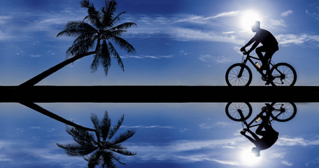 Fototapeta na wymiar silhouette of cyclist in motion