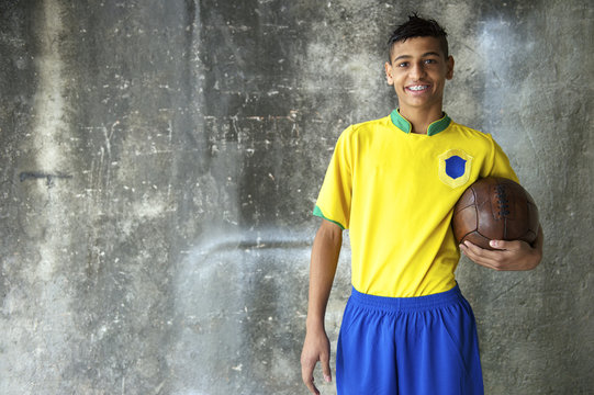 Smiling Young Brazilian Soccer Player Uniform Holding Football