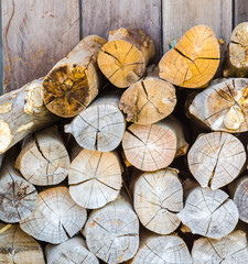 Fototapeta premium firewood on wood background
