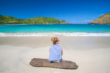 young woman on tropical beach