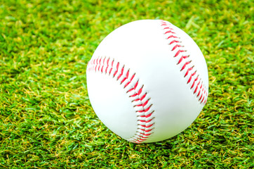 Baseball on green grass