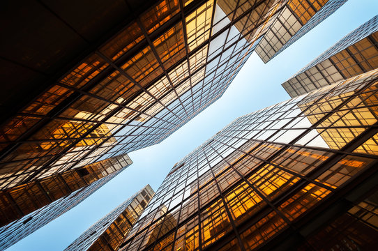 Upwards shot of Hong Kong office buildings reflecting light