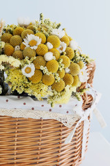 Close-up on the dried flowers with basket.