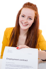Happy young woman is happy about her employment contract - 63839016