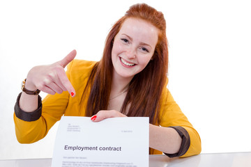 Happy young woman is happy about her employment contract - 63839033