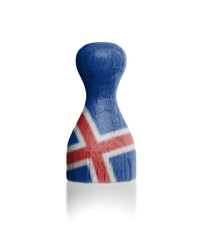 Wooden pawn with a flag painting