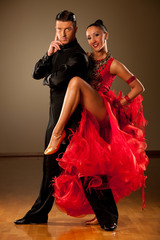  Professional ballroom dance couple preform an exhibition dance - obrazy, fototapety, plakaty