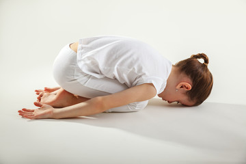 Fototapeta na wymiar Young girl doing yoga