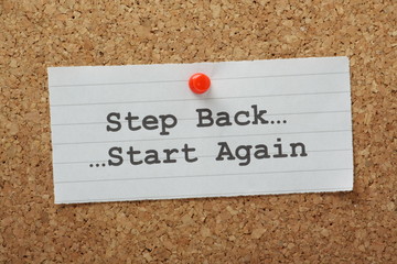 The phrase Step Back and Start Again on a notice board