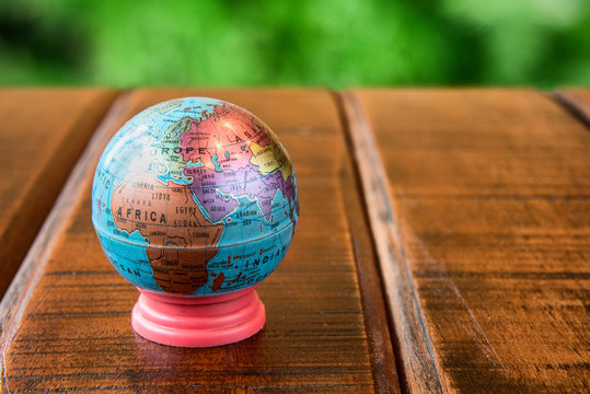 Small World Globe Standing On A Desk