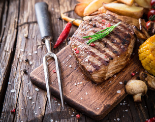 Beef steak on wooden table
