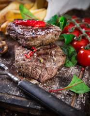 Beef steak on wooden table
