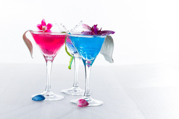 Blue swimming pool Cocktail with caviar and flower petals