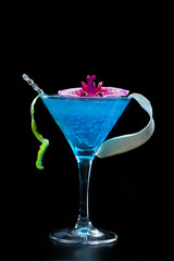 Blue swimming pool Cocktail with caviar and flower petals