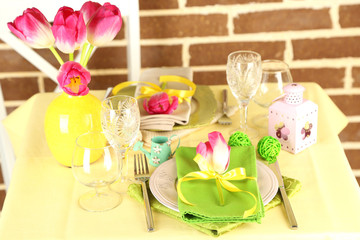 Beautiful spring table setting on bright background