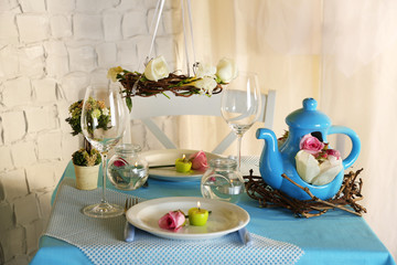 Beautiful holiday Easter table setting in blue tones,