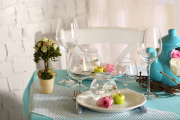 Beautiful holiday Easter table setting in blue tones,
