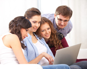 four students and a laptop