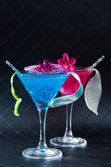 Blue swimming pool Cocktail with caviar and flower petals