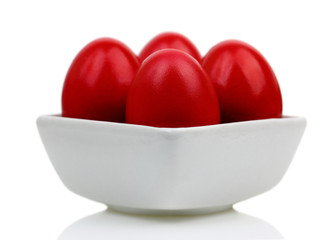 Red Easter eggs in a bοwl