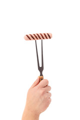 Grilled sausage on a fork.