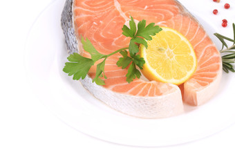 Raw salmon steak with parsley.