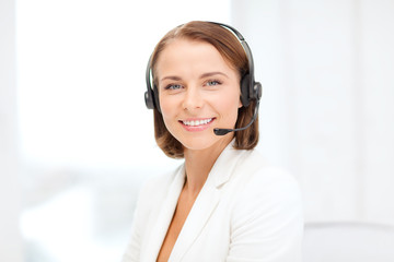 smiling female helpline operator with headphones