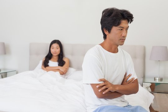 Couple not talking after argument in bed