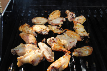 Grilling Chicken Wing Pieces on a Hot Grill