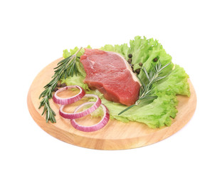 Raw beefsteak on platter.