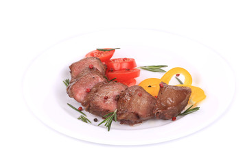 Beefsteaks with tomatoes and rosemary.