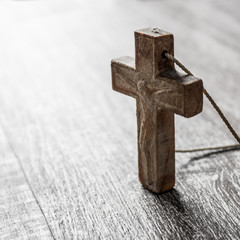 wooden cross on a wooden surface