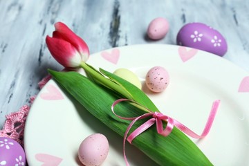 Easter table setting with tulips and eggs