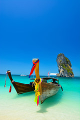 Cliff and boat in the amazing beach in tropical island in Krabi, Phuket, Thailand - 63859894