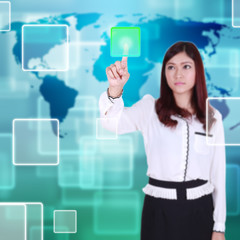 woman pushing button on a touch screen