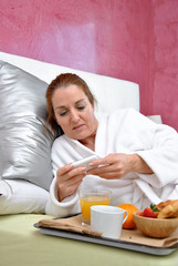 Obraz na płótnie Canvas woman breakfast in her bed peacefully
