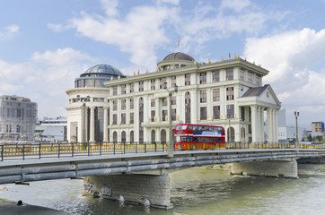 Vardar river and red doubledecker bus, Skopje,  Macedonia