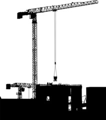 Silhouettes of cranes on building