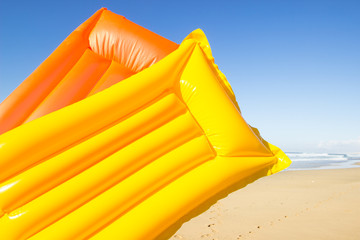 yellow and orange air mattress