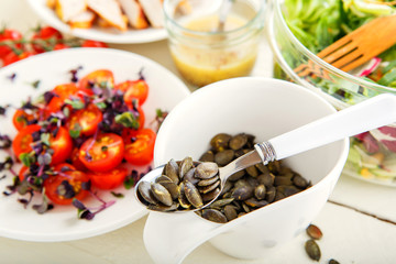 Salad with grilled meat, smoked fish and different vegetables.