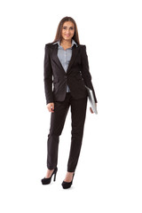 Business woman with laptop standing in full length isolated on w