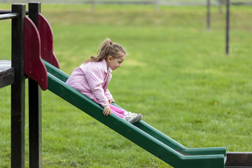 Cute little girl playing in the park