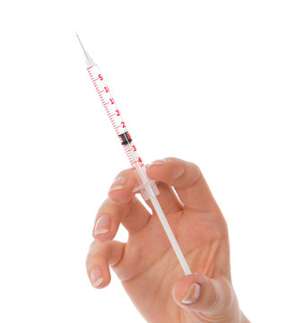 Doctor hand with medical insulin syringe ready for injection i