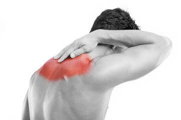 Rear view of a young man with back pain