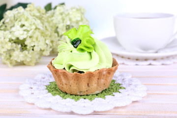 Tasty cake on table on light background