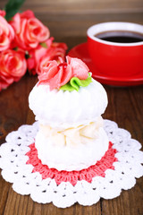 Fototapeta na wymiar Tasty cake on table on wooden background