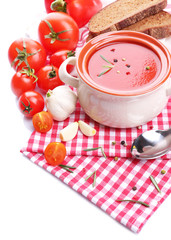 Tasty tomato soup and vegetables, isolated on white