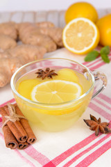 Healthy ginger tea with lemon and honey on table close-up